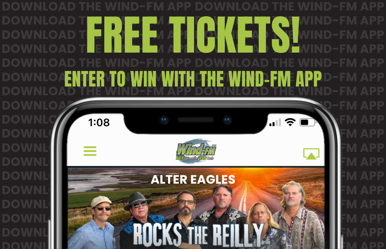 Promo banner promising 'FREE TICKETS!' and 'ENTER TO WIN WITH THE WIND-FM APP' above a smartphone screen showing the Wind-FM app and the Alter Eagles band image.
