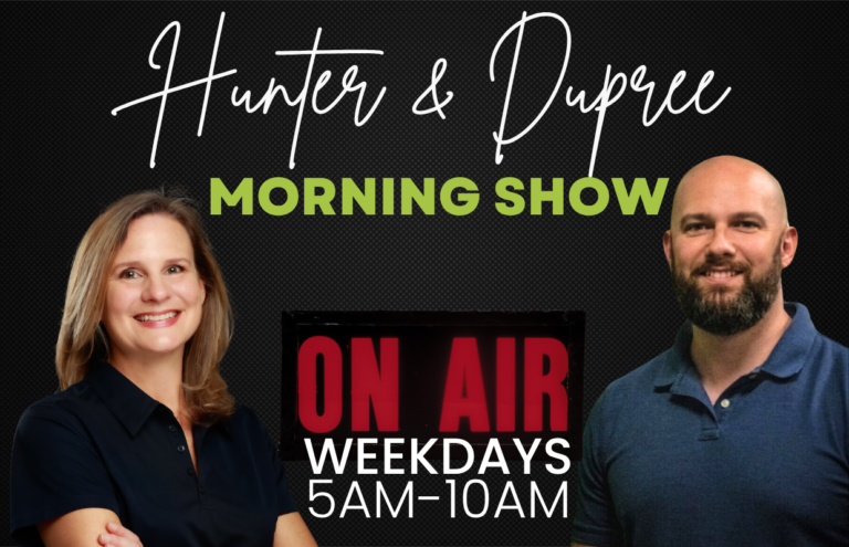 Banner for Hunter & Dupree Morning Show with a smiling woman on the left, a smiling man on the right, and an ON AIR sign in the center; text reads 'Weekdays 5AM-10AM'.